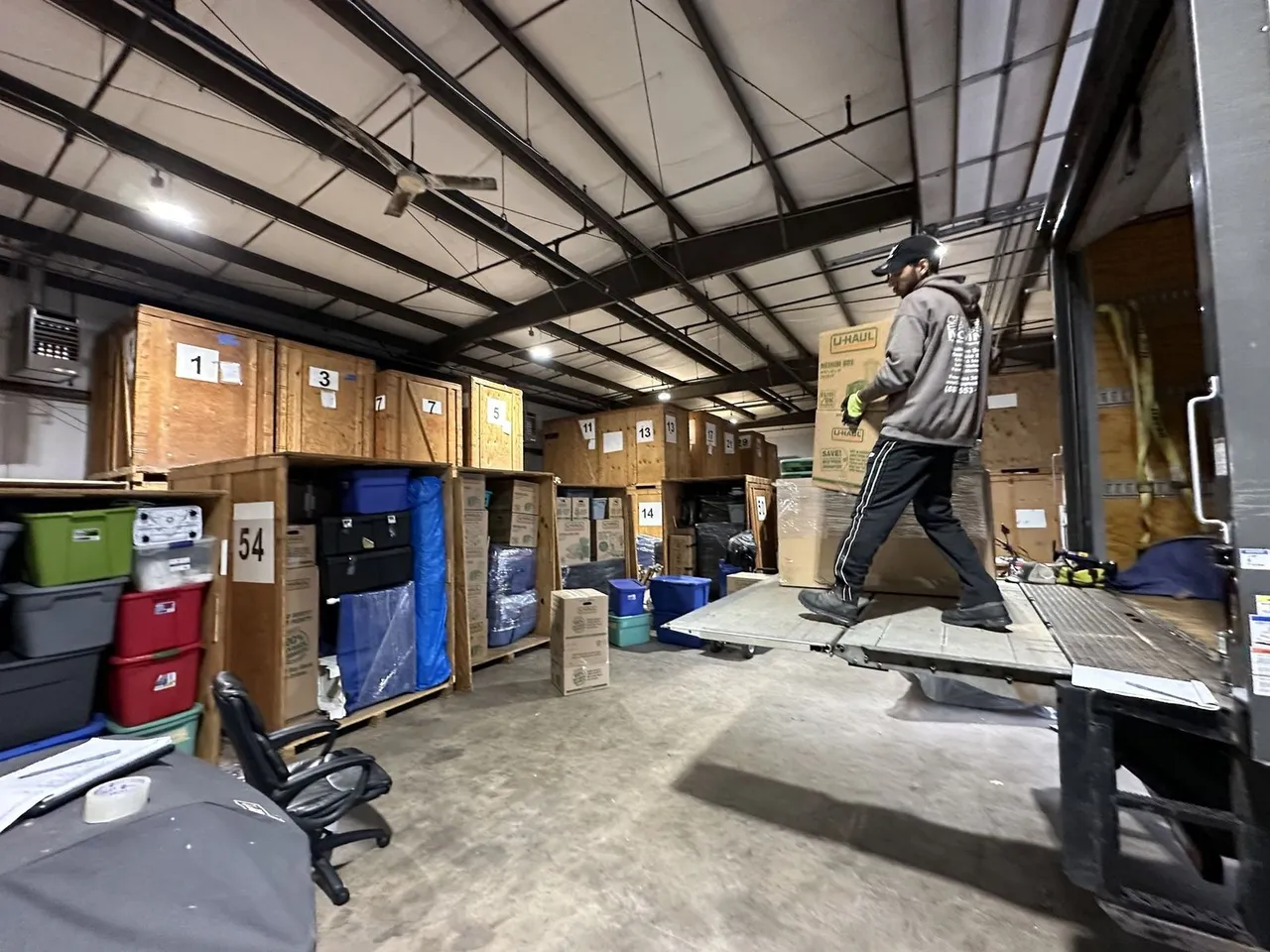 Castle Express crew member loading items from truck into storage facility