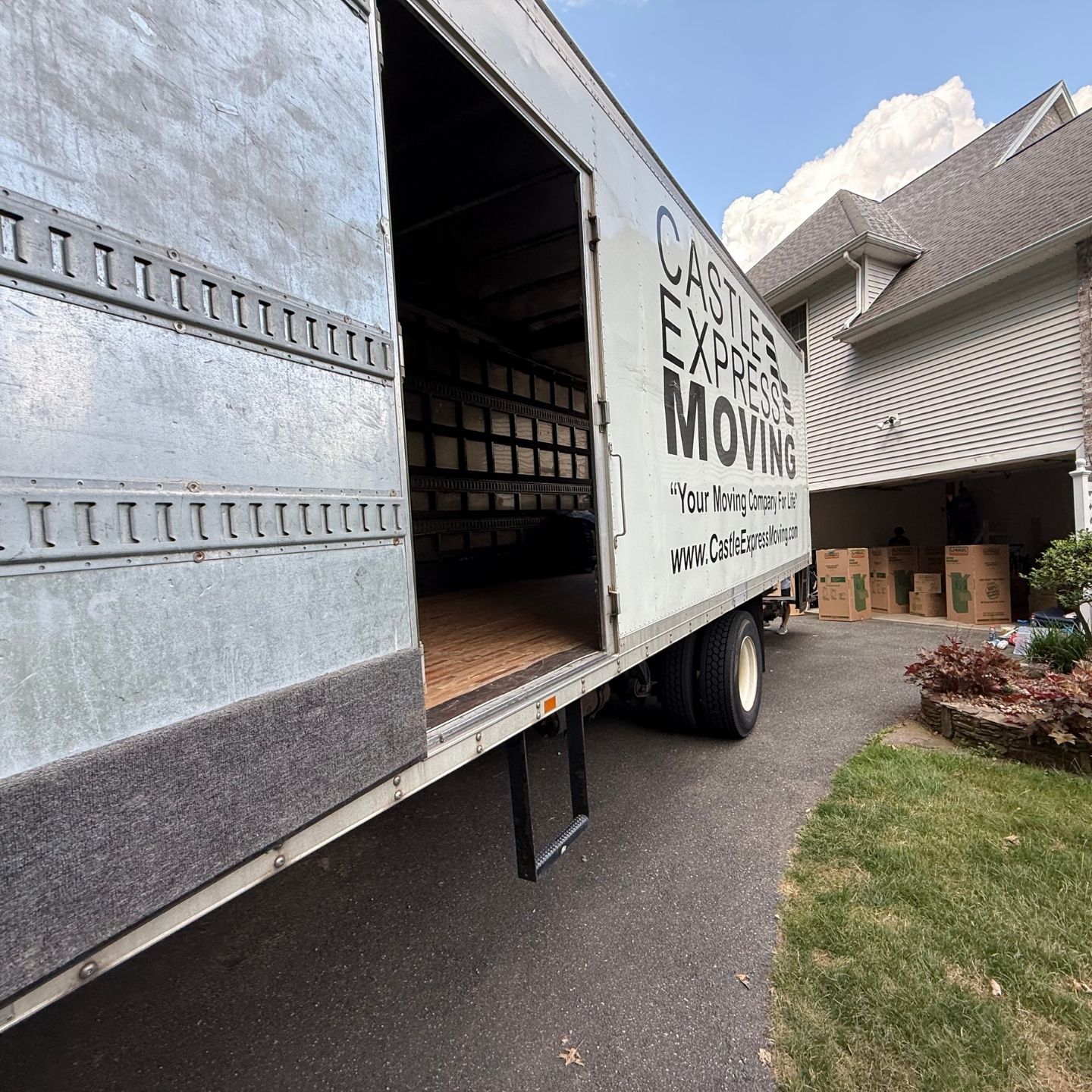 Castle Express truck being loaded with furniture